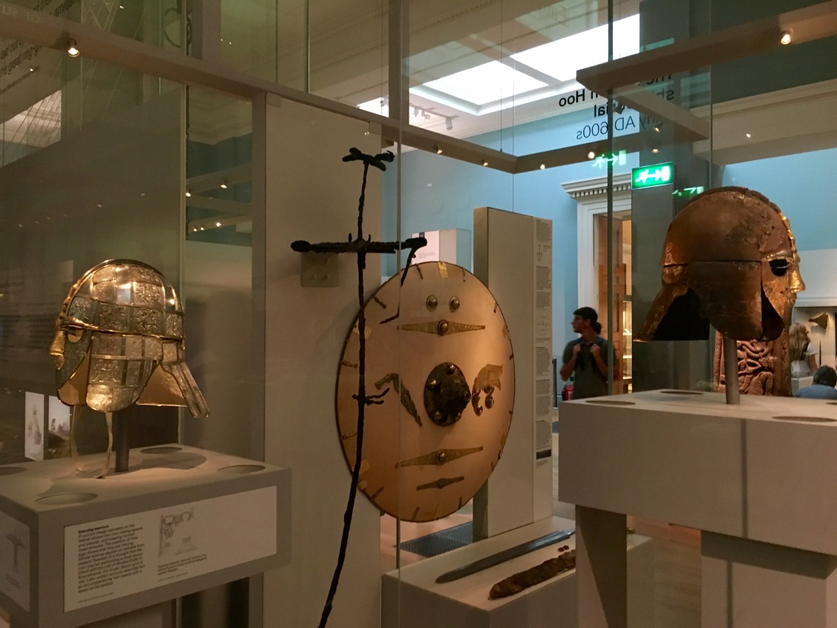 Display case with helmets and shield